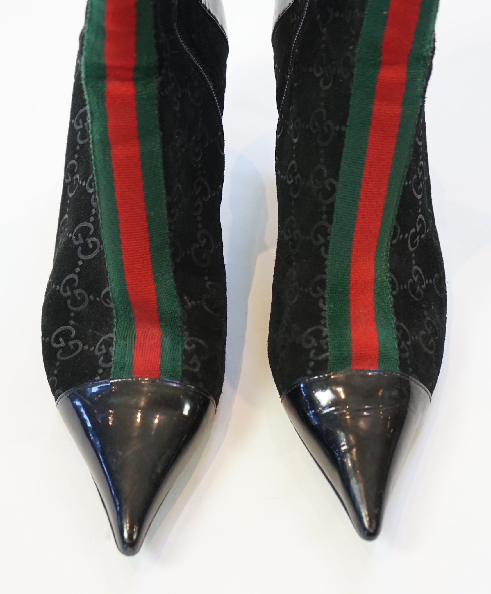 A pair of Gucci monogram pattern and ribbon black lady's suede ankle boots, size EU 38.5